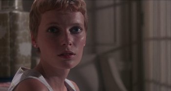 Movie still from “Rosemary's Baby” (1968), directed by Roman Polanski – A person with short blonde hair; Close Up shot, Low angle