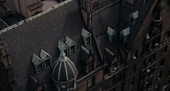 Movie still from “Rosemary's Baby” (1968), directed by Roman Polanski – An aerial view of a building with many windows; Extreme Wide shot, Overhead angle