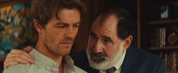 Movie still from “Run & Gun” (2022), directed by Christopher Borrelli – A man with a beard and a man with short hair; Close Up shot, Over the shoulder angle