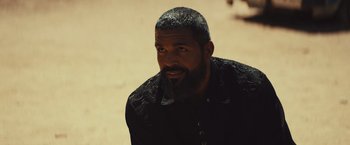 Movie still from “Run & Gun” (2022), directed by Christopher Borrelli – A man with a beard is looking at the camera; Close Up shot, Over the shoulder angle