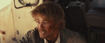 Movie still from “Run & Gun” (2022), directed by Christopher Borrelli – A person wearing a jacket; Close Up shot, Over the shoulder angle