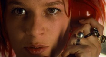 Movie still from “Run Lola Run” (1998), directed by Tom Tykwer – A woman's face with red hair; Extreme Close Up shot, Overhead angle