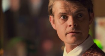 Movie still from “Run Lola Run” (1998), directed by Tom Tykwer – A man's face in a white shirt; Close Up shot, Low angle