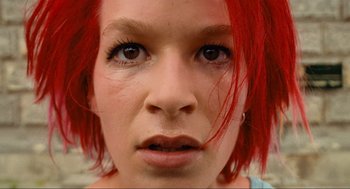 Movie still from “Run Lola Run” (1998), directed by Tom Tykwer – A person with red hair; Close Up shot, Low angle