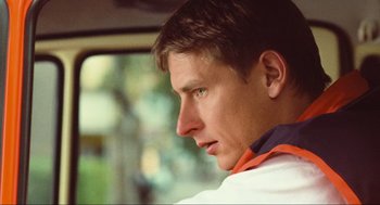 Movie still from “Run Lola Run” (1998), directed by Tom Tykwer – A person sitting in a car; Close Up shot, Low angle