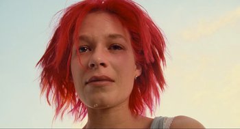 Movie still from “Run Lola Run” (1998), directed by Tom Tykwer – A person with red hair; Close Up shot, Low angle