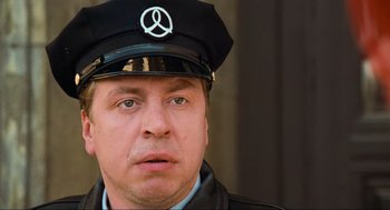 Movie still from “Run Lola Run” (1998), directed by Tom Tykwer – A person wearing a hat; Close Up shot, Low angle