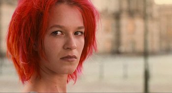 Movie still from “Run Lola Run” (1998), directed by Tom Tykwer – A person with red hair; Close Up shot, Low angle