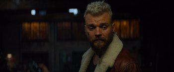 Movie still from “Samaritan” (2022), directed by Julius Avery – A man with a white beard and a white jacket; Close Up shot, Over the shoulder angle