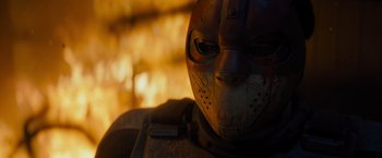 Movie still from “Samaritan” (2022), directed by Julius Avery – A person's face in a mask; Close Up shot, Low angle