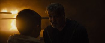 Movie still from “Samaritan” (2022), directed by Julius Avery – An older man talking to a younger man in a dark room; Close Up shot, Over the shoulder angle