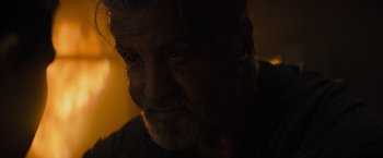 Movie still from “Samaritan” (2022), directed by Julius Avery – A person's face in the dark; Close Up shot, Over the shoulder angle