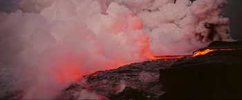 Movie still from “Samsara” (2011), directed by Ron Fricke – A view of a lava flow from a volcano; Extreme Wide shot, High angle