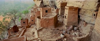 Movie still from “Samsara” (2011), directed by Ron Fricke – An old village in the middle of the desert; Extreme Wide shot, High angle