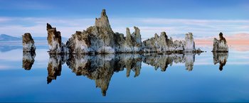 Movie still from “Samsara” (2011), directed by Ron Fricke – A body of water that has some rocks in the water; Extreme Wide shot, Low angle