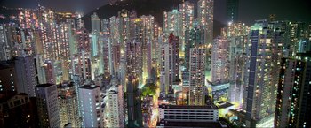 Movie still from “Samsara” (2011), directed by Ron Fricke – A view of a large city at night time; Extreme Wide shot, High angle