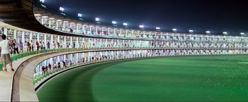 Movie still from “Samsara” (2011), directed by Ron Fricke – A stadium with many people in it at night time; Extreme Wide shot, High angle