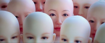 Movie still from “Samsara” (2011), directed by Ron Fricke – A group of heads with one of them looking at the camera; Extreme Close Up shot, Overhead angle