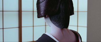 Movie still from “Samsara” (2011), directed by Ron Fricke – The back of a woman's head; Close Up shot, Over the shoulder angle