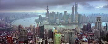 Movie still from “Samsara” (2011), directed by Ron Fricke – A view of a large city from a bird's eye view; Extreme Wide shot, High angle