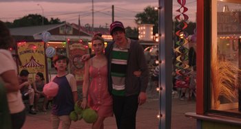 Movie still from “Big Time Adolescence” (2019), directed by Jason Orley – A man and a woman and a boy are walking together; Medium shot, Over the shoulder angle