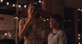 Movie still from “Big Time Adolescence” (2019), directed by Jason Orley – A woman standing next to a young boy; Medium shot, Over the shoulder angle