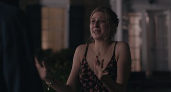 Movie still from “Big Time Adolescence” (2019), directed by Jason Orley – A young woman is crying while holding her hands up; Close Up shot, Over the shoulder angle