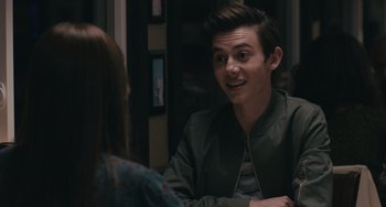 Movie still from “Big Time Adolescence” (2019), directed by Jason Orley – A man and a woman are talking to each other; Close Up shot, Over the shoulder angle