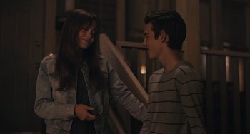 Movie still from “Big Time Adolescence” (2019), directed by Jason Orley – A man and a woman talking to each other; Medium shot, Over the shoulder angle