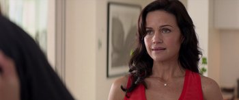 Movie still from “San Andreas” (2015), directed by Brad Peyton – A person wearing a red dress; Close Up shot, Over the shoulder angle