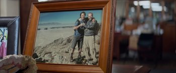 Movie still from “San Andreas” (2015), directed by Brad Peyton – A picture of two men posing for a picture; Extreme Close Up shot, Overhead angle