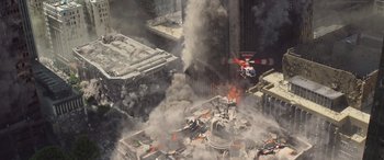 Movie still from “San Andreas” (2015), directed by Brad Peyton – An aerial view of a helicopter flying over a building; Extreme Wide shot, Overhead angle