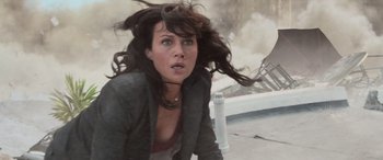 Movie still from “San Andreas” (2015), directed by Brad Peyton – A woman with long brown hair is in the air; Medium shot, High angle