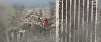 Movie still from “San Andreas” (2015), directed by Brad Peyton – A helicopter flying through the air near a building; Extreme Wide shot, High angle