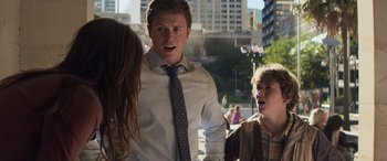 Movie still from “San Andreas” (2015), directed by Brad Peyton – A man and two young boys are talking to each other; Medium shot, Over the shoulder angle