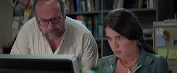 Movie still from “San Andreas” (2015), directed by Brad Peyton – A man and a woman looking at a computer screen; Close Up shot, Over the shoulder angle