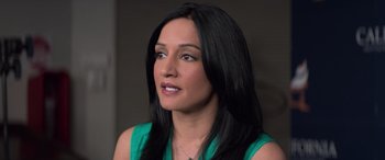 Movie still from “San Andreas” (2015), directed by Brad Peyton – A person with long black hair; Close Up shot, High angle