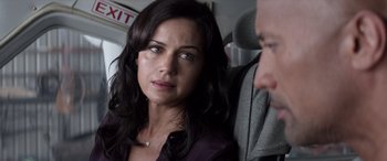 Movie still from “San Andreas” (2015), directed by Brad Peyton – A person sitting in a car seat; Close Up shot, Over the shoulder angle