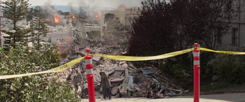 Movie still from “San Andreas” (2015), directed by Brad Peyton – Two people standing in front of a pile of rubble; Extreme Wide shot, High angle