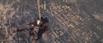 Movie still from “San Andreas” (2015), directed by Brad Peyton – An aerial view of a city with a skydiver in the air; Wide shot, Overhead angle