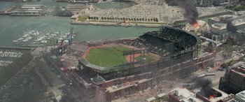 Movie still from “San Andreas” (2015), directed by Brad Peyton – An aerial view of a baseball field with a stadium in the background; Extreme Wide shot, High angle