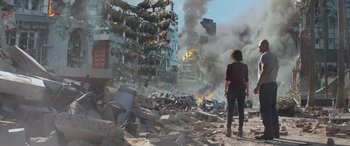 Movie still from “San Andreas” (2015), directed by Brad Peyton – A woman standing in the middle of a destroyed city; Wide shot, Low angle