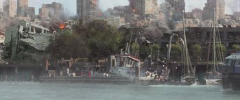 Movie still from “San Andreas” (2015), directed by Brad Peyton – A boat in the middle of the water with a bunch of smoke coming out of it; Extreme Wide shot, High angle
