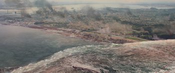 Movie still from “San Andreas” (2015), directed by Brad Peyton – An aerial view of the ocean and a city in the background; Extreme Wide shot, Overhead angle