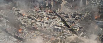 Movie still from “San Andreas” (2015), directed by Brad Peyton – An aerial view of a large city with buildings; Extreme Wide shot, Overhead angle