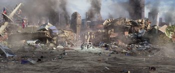 Movie still from “San Andreas” (2015), directed by Brad Peyton – An image of an apocalyptic scene with a car in the middle of the road; Extreme Wide shot, High angle