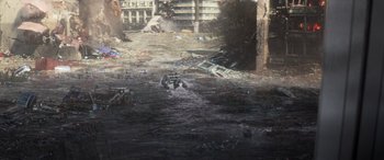 Movie still from “San Andreas” (2015), directed by Brad Peyton – An oil painting of a flooded street with debris strewn across the street; Extreme Wide shot, High angle