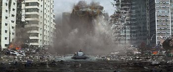 Movie still from “San Andreas” (2015), directed by Brad Peyton – A man is in a boat in the middle of a city; Extreme Wide shot, Low angle