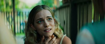 Movie still from “Savage Salvation” (2022), directed by Randall Emmett – A beautiful young woman with blue eyes and blonde hair; Close Up shot, Low angle