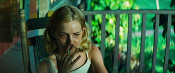 Movie still from “Savage Salvation” (2022), directed by Randall Emmett – A woman with a finger in her mouth; Close Up shot, Over the shoulder angle